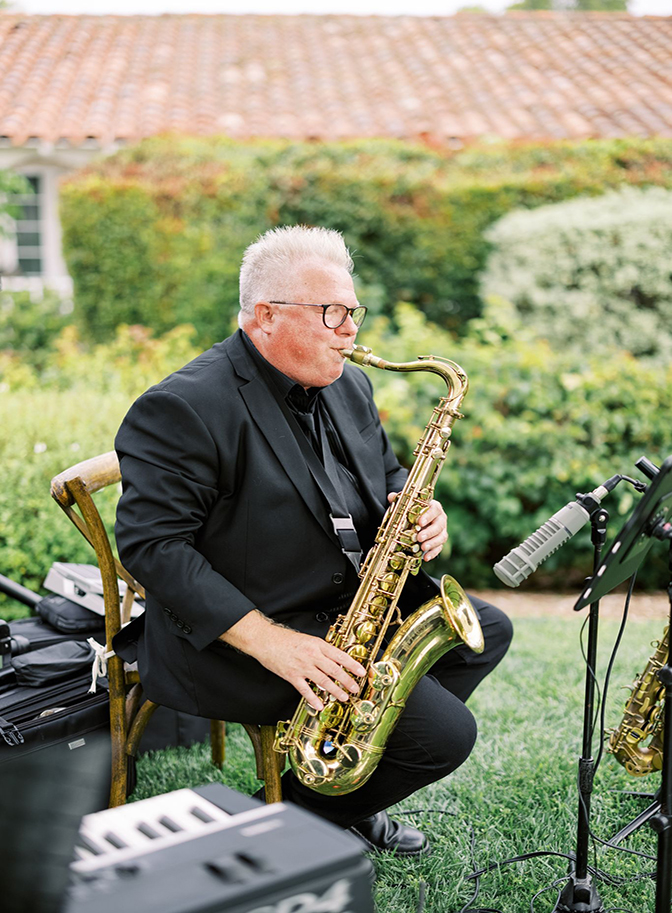 Wedding day music band man on saxophone