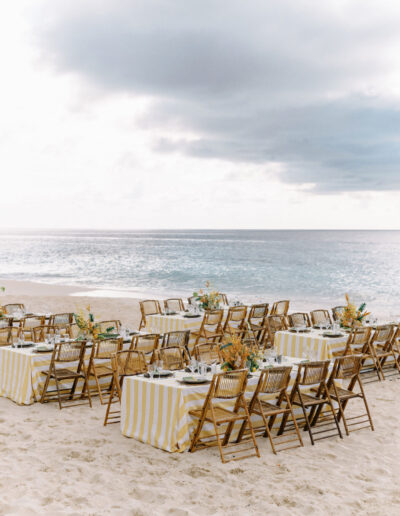 Wedding weekend at Malliouhana Resort in Anguilla with beachy stripes, fringe and tropical florals for the prettiest beach welcome party.