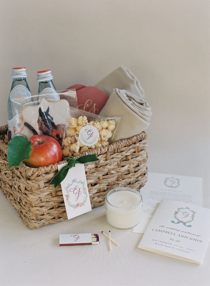 image of wedding welcome basket filled with snacks, drinks, a candle, and a personalized card for a destination wedding
