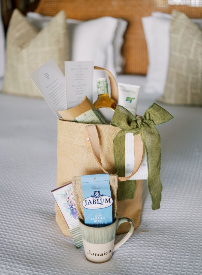 photo of wedding welcome bag with a cup coffee mug, coffee, and various other items.