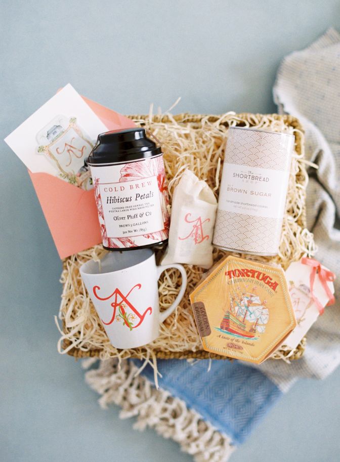 image of wedding welcome basket containing cold brew tea, a car, a coffee mug, and local brown sugar