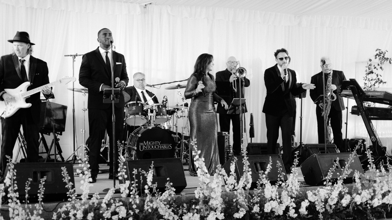 black and white photo of band performing at wedding reception