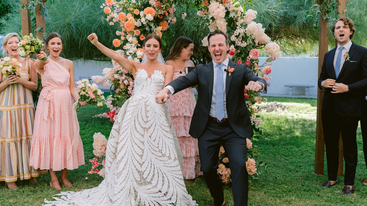 photo of bride and groom celebrating after saying "I do"