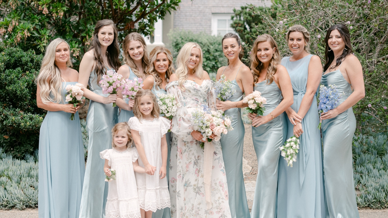 photo of bride with bridesmaids and flower girls