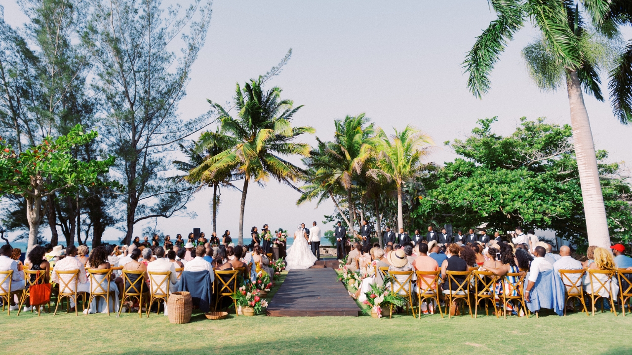 photo of tropical wedding ceremony with a view of the ocean