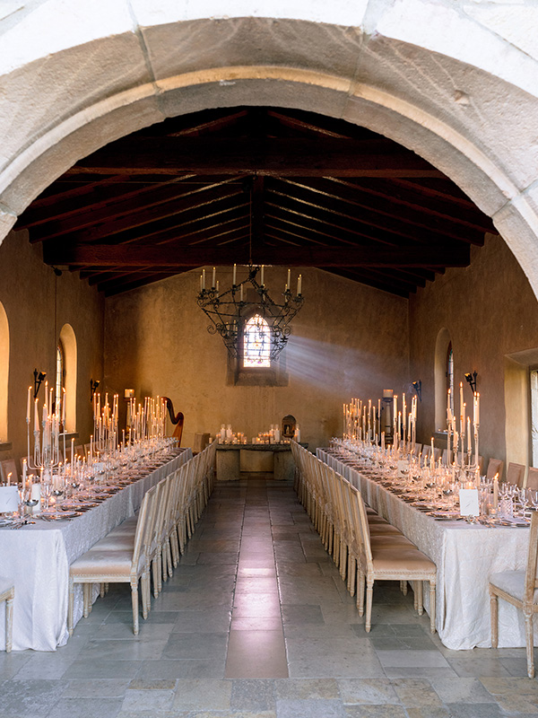 candlelit dinner inside a magical, minimalist yet old-world–inspired chapel