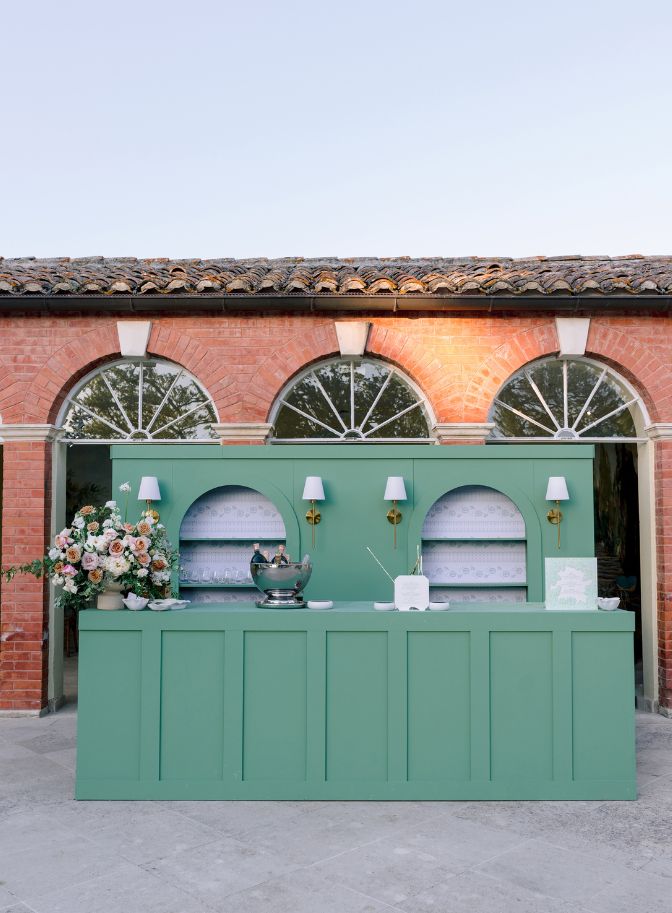 photo of green wedding reception bar